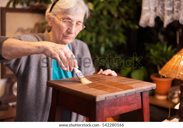 Old Woman Refurbishing Furniture Stock Image Download Now