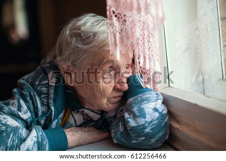 Old woman is sad emotions the home.