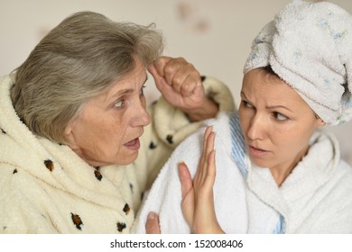 old woman scolds the young woman at home
