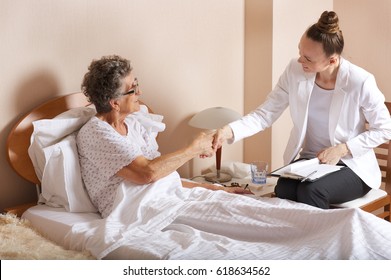 Old Woman With Senior Social Work Assistant