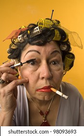 Old Woman Smoking And Applying Make Up