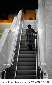 The Old Woman At The Train Station On Elevator Stairs