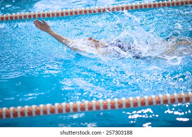 Old Woman Training To Swim The Backstroke