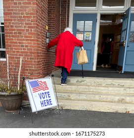 Old Woman Voter Entering Voting Polling Place For USA Government Election 