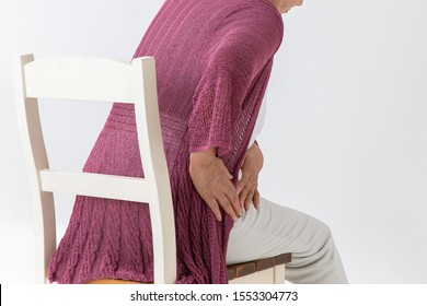 The old woman who has a pain in a hip joint