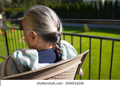 old woman in the yard - Shutterstock ID 1034516236