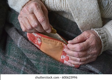 Old Woman`s Hands With A Wallet And Coins. Saving Money Concept