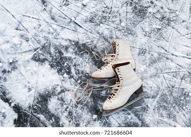 Old Womans Ice Skates On The Ice.