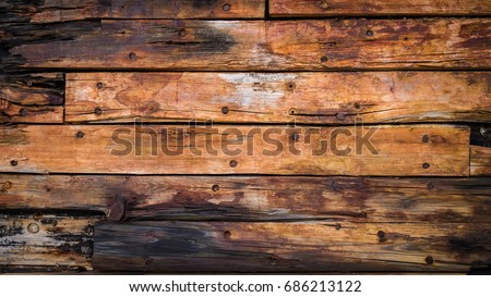 old wood boards on the deck and the hull of the ship