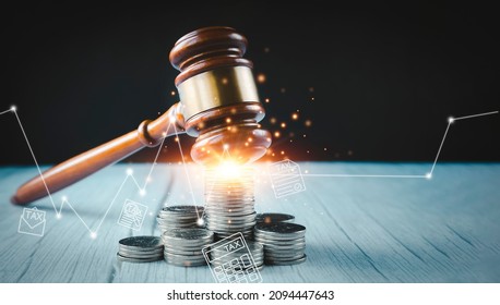 Old wood Judge hammer with stacking coins in close-up and coins stack the table wood background, Used for adjudication and Justice. - Shutterstock ID 2094447643