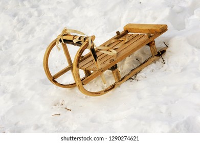 Old wood sled in the snow in winter - Shutterstock ID 1290274621