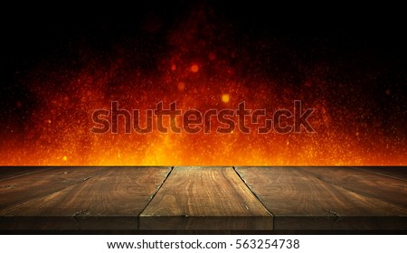 Old wood table on flame with bokeh background. 