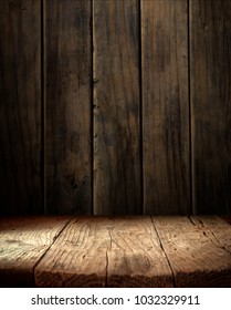 Old wood table top with smoke in the dark background. - Shutterstock ID 1032329911