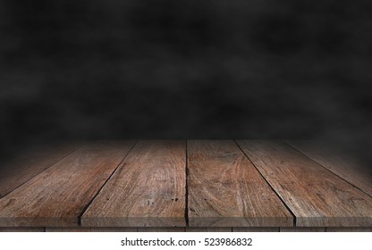 Old Wood Table Top With Smoke In The Dark Background.