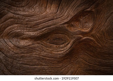 Old wood texture background with natural cracks. Dark brown wood plank is used for background.

