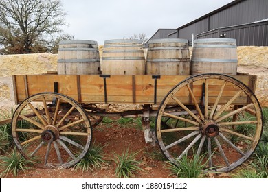 An Old Wood Wagon With Wine Barrels Loaded In A Carriage Nearby Fredericksburg, Texas