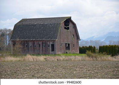 Old Wooden Abandoned Barn On Farm