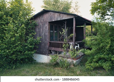 Old wooden allotment house with veranda
