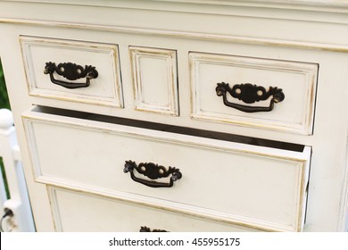 Old Wooden Antique Chest Of Drawers With Metal Handles Closeup, Open Drawer Shelf. Shabby Chic Vintage Style Interior, Furniture Detail From Rustic White Wood.