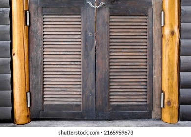 Old Wooden Bar Door. Louvered Doors Close-up. Saloon Doors