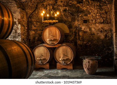 Old Wooden Barrels With Wine In A Wine Vault