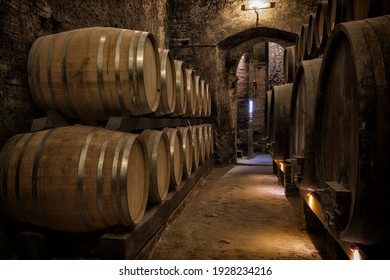Old Wooden barrels with wine in a wine vault
