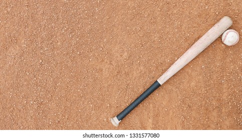 Old Wooden Bat With Ball View From Above On Baseball Field.  Copy Space For Sports Banner Concept.