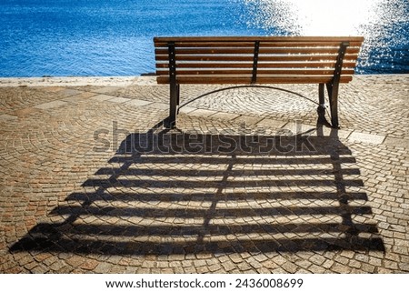 old wooden bench at torbole - lago di garda - italy