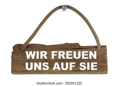 Old Wooden Board With Rope Showing We Look Forward To See You In German Language