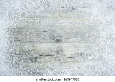 Old wooden board with snow flakes. Christmas background - Powered by Shutterstock