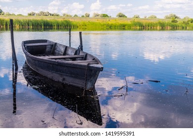 Old Wooden Boats On The Shore Of A Marshy River. Rustic Landscape Of Louisiana, USA