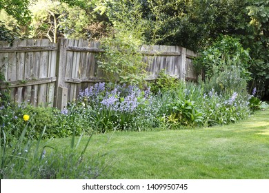 Old Wooden Boundary Fence In A Suburban Back Garden In London, UK