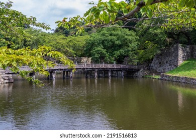 An Old Wooden Bridge Over The Moat Of Hikone Castle