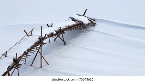 Old Wooden Broken  Footbridge Covered With Snow