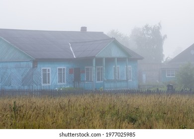 The Old Wooden Building Of The Village Administration And The Police Station. Morning Fog In The Countryside. Rural Landscape. Demyanovsky Pogost Village, Babushkinsky District, Vologda Region, Russia