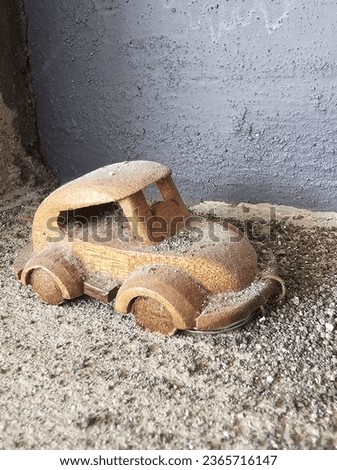 an old wooden car that has been buried in sand