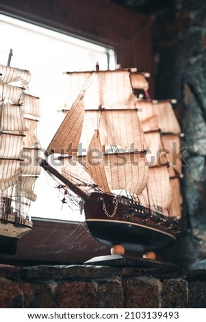 Old wooden carved sailing boat figure