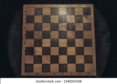 Old Wooden Chess Board Background. Top View.