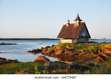 Old Wooden Church On Sunset Near White Sea, Russia North