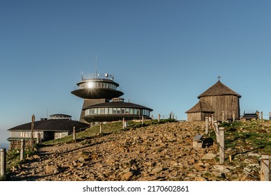 Old wooden church on the top of Snezka,the highest mountain of Czech Republic,Krkonose Mountains.Chapel of Saint Lawrence and Polish chalet.Hiking to the summit.Sunny day in Czech countryside.
