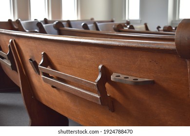 Old Wooden Church Pews With Hymnal Racks And Communion Cup Holders. 