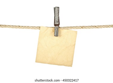 Old Wooden Clothespin On Rope With Old Paper