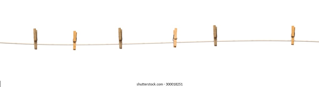 Old wooden clothespins on a rope isolated on  white background