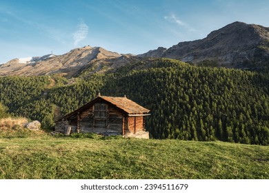 Old wooden cottage on hill among the Swiss Alps in Findeln mountain village at Zermatt, Switzerland - Shutterstock ID 2394511679
