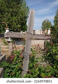 Old Wooden Cross In A Cemetery 