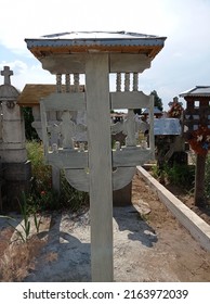 Old Wooden Cross In A Cemetery 