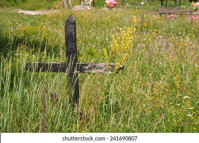 Old Wooden Cross In The Field