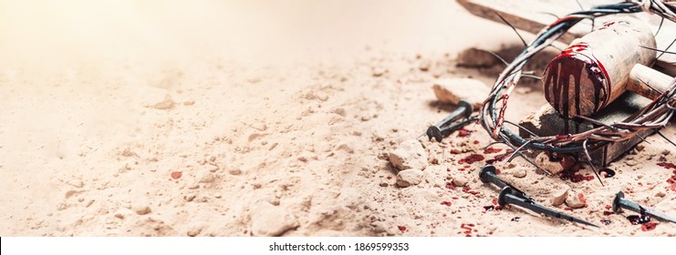 Old wooden cross, hammer, bloody nails and crown of thorns on ground. Banner. Copy space. Good friday. Passion, crucifixion of Jesus Christ. Christian Easter holiday. Gospel, salvation.