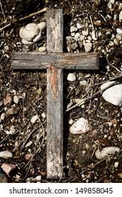 Old Wooden Cross Lying On A Ground