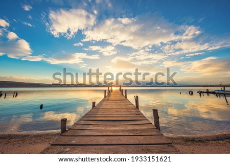Old wooden dock at the lake, sunset shot
